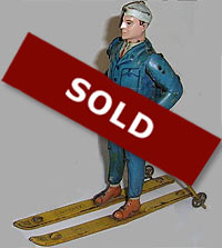 Tin toy of Skier